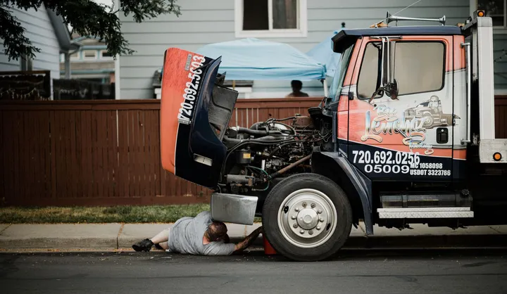 Mechanic working on a truck engine